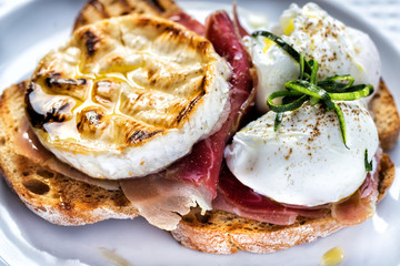 camambert with serrano ham and poached egg