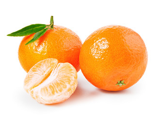 Tangerine or clementine with green leaf and slices isolated on white