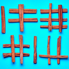 cinnamon sticks on color background