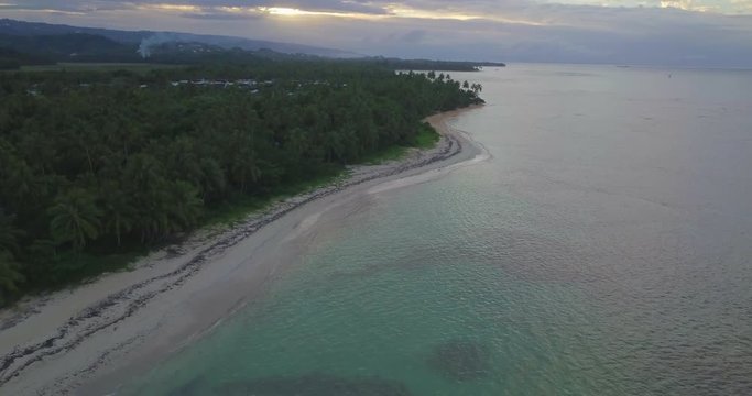 FIB - Flying Inflatable Boat. Aerial shot from Above of the amphibious aircraft coming from distance and performing in the sky right above the sea.