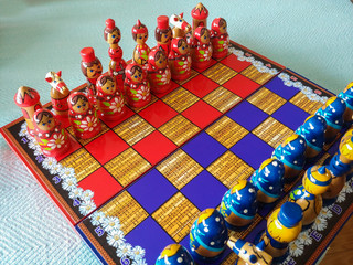 A beautiful Russian handmade red and blue chess set, made in Matryoshka (nesting doll) style.