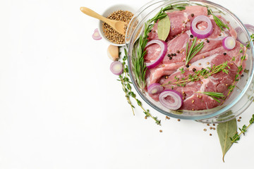 Fresh meat and spices on a white background. Close-up.