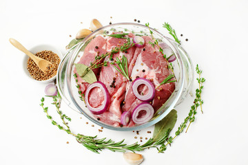 Fresh meat and spices on a white background. Close-up.