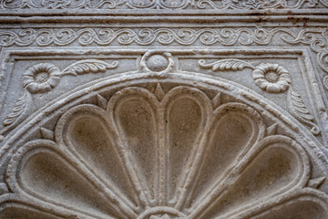 Close-up photo of marble elements of Roman buildings architectural decorations and repeating patterns at public places on streets of Sofia, Bulgaria