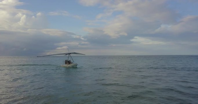 FIB - Flying Inflatable Boat. Aerial shot following the Amphibious Aircraft Accelerating in the Caribbean Sea Just before Taking Off