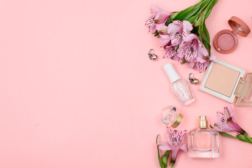 Obraz na płótnie Canvas Makeup cosmetics on pink background with copyspace