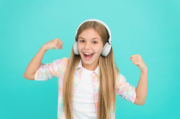 Enjoy a completely hands free listening experience. Little girl child listening to music. Happy...