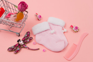  Children's things and accessories on a pink background. Baby concept