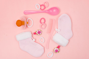 Its a Girl pink theme Baby Shower or Nursery background with decorated borders on pink wood background. 