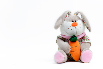 Soft toy hare on a white background
