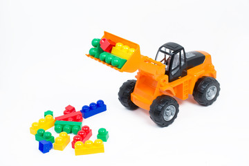 Fototapeta premium Colored toys for children on a white background