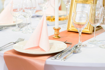Wedding table place setting, plates and glasses