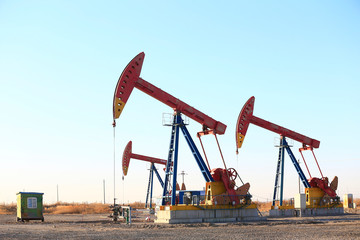 Pumping units at work in the blue sky background