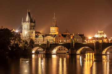 Obraz na płótnie Canvas Vltava River and Charles Bridge with Old Town Bridge Tower by night, Prague, Czechia. UNESCO World Heritage Site
