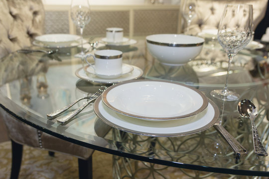 Plates and glasses on the table. Luxurious serving