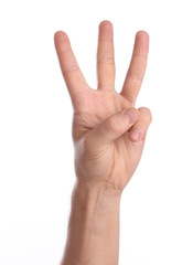 Man showing three fingers on white background, closeup of hand