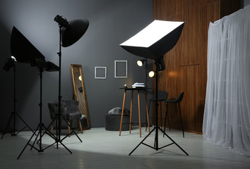Example of living room interior design and professional equipment in photo studio