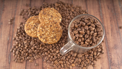 Oatmeal cookies and coffee beans. The concept of morning Breakfast