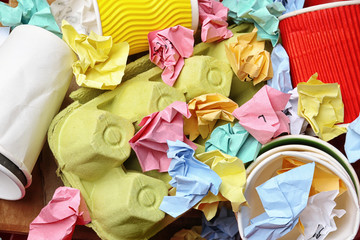 Pile of paper and cardboard garbage as background, top view. Recycling problem