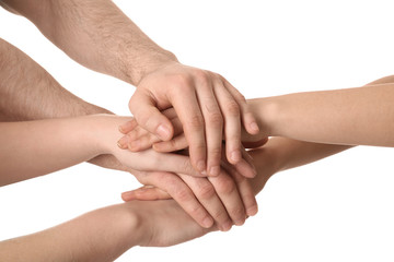 Young people putting their hands together on white background, closeup
