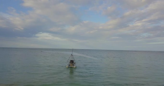 FIB - Flying Inflatable Boat. Aerial shot following the Amphibious Aircraft Sailing in the Sea just before Taking Off