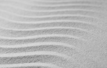 Fototapeta na wymiar Zen garden pattern on sand. Meditation and harmony