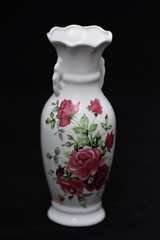 Chinese vase painted with roses on  black background