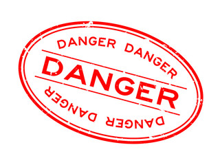 Grunge red danger word oval rubber seal stamp on white background