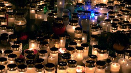 Bright lights of burning candles in the darkness 