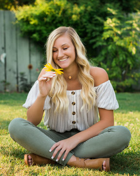High School Senior Photo of Blonde Caucasian Girl Outdoors