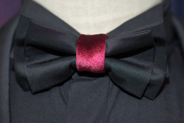black bow tie with cherry-colored