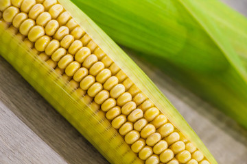 Fresh yellow corn on a wooden background