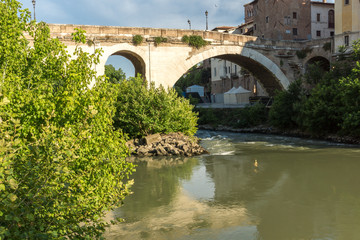 Cityscape with Castello Caetani, Tiber River and Pons Fabricius in city of Rome, Italy