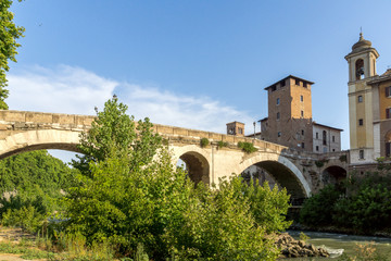 Cityscape with Castello Caetani, Tiber River and Pons Fabricius in city of Rome, Italy