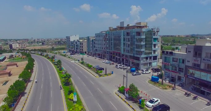 Model road with buildings and river drone view, cars running, Chitwan, Nepal