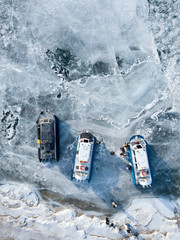 Photo from drone of ships on snowy frozen Baikal lake. Olkhon, Irkutsk, Russia. Winter.