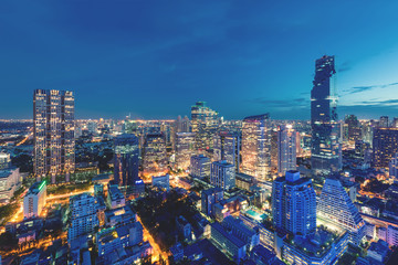 Naklejka premium Modern building in Bangkok business district at Bangkok city with skyline at twilight, Thailand.