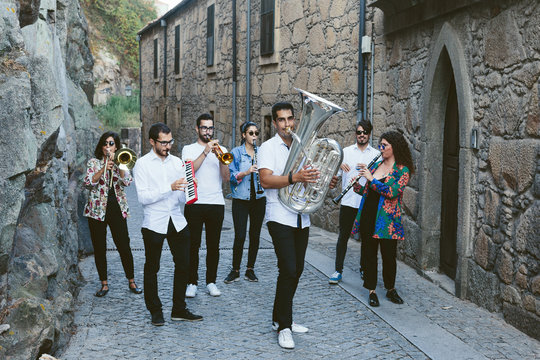 Musician band playing together outdoor on European  city street