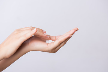 Healthcare concept. Closeup shot of  young woman hands applying moisturizing hand cream.