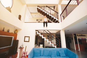 Woman relaxing in 3 floors luxury villa