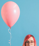 Pink haired girl with a balloon