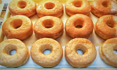 Donuts on bakery tray. 