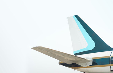The tail part of the plane with blue sky background.