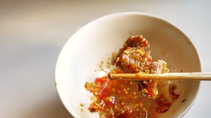 Pork grilled with dipping sauce.