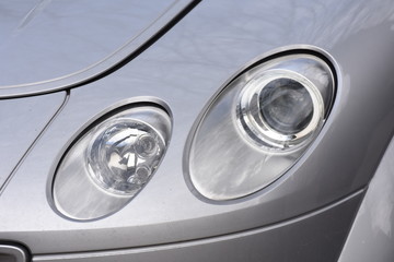 shiny headlight on a  white car