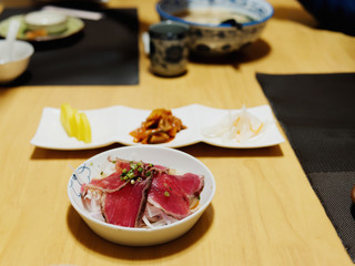 Japanese Cuisine, wagyu roast beef bowl on table. Concept of menu or Asian oriental meal eating culture.