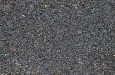 Closeup of asphalt ground of the road under sunlight. The natural art background and template. 