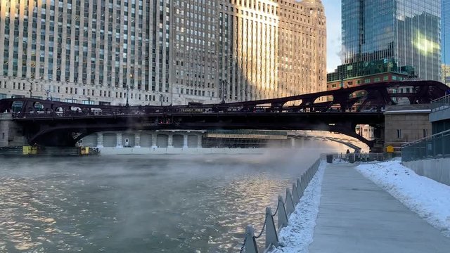 Steam rising and blowing across the Chicago River as temperatures plunge on a freezing January morning in the Chicago Loop.