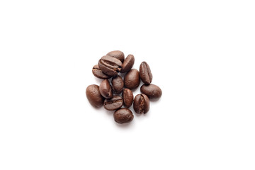 Roasted coffee beans isolated on white background. Close-up.