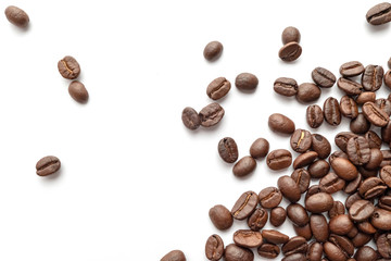 Roasted coffee beans isolated on white background. Close-up.